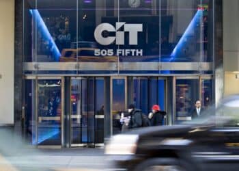 Pedestrians walk outside the former headquarters building of CIT Group Inc., in New York, U.S., on Monday, Feb. 8, 2010. John Thain, the ousted chief of Merrill Lynch & Co., was named to lead CIT Group Inc., the commercial lender that emerged from bankruptcy in December, after almost a four-month search for a replacement
