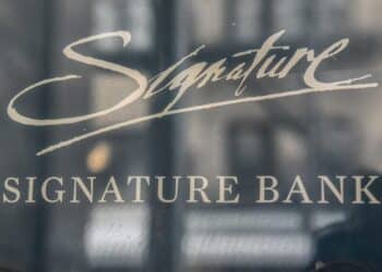 Signage outside a Signature Bank branch in New York, US, on Monday, March 13, 2023. The sudden closure of New York's Signature Bank by state regulators Sunday underscored the urgency of extraordinary US efforts to backstop the nations banking system and quell mounting concerns among customers about the safety of their deposits.