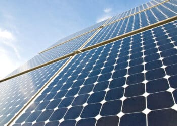 Solar panels against a serene blue sky