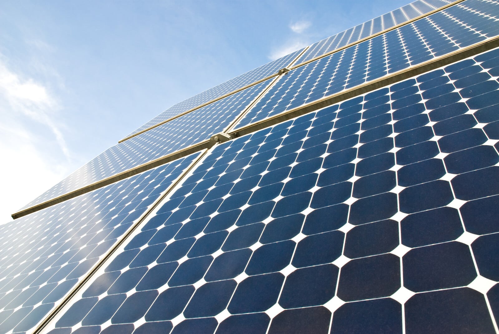 Solar panels against a serene blue sky