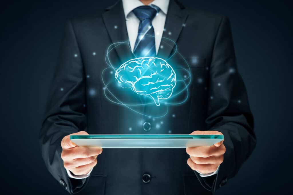 Also, Artificial intelligence (ai), machine deep learning, data mining, expert system software, and another modern computer technologies concepts. brain representing artificial intelligence and businessman holding futuristic tablet.
