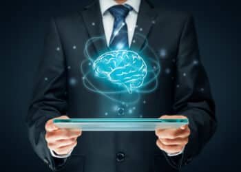 Artificial intelligence (ai), machine deep learning, data mining, expert system software, and another modern computer technologies concepts. brain representing artificial intelligence and businessman holding futuristic tablet.