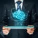 Artificial intelligence (ai), machine deep learning, data mining, expert system software, and another modern computer technologies concepts. brain representing artificial intelligence and businessman holding futuristic tablet.