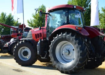 Red tractor and combine in an exhibition
