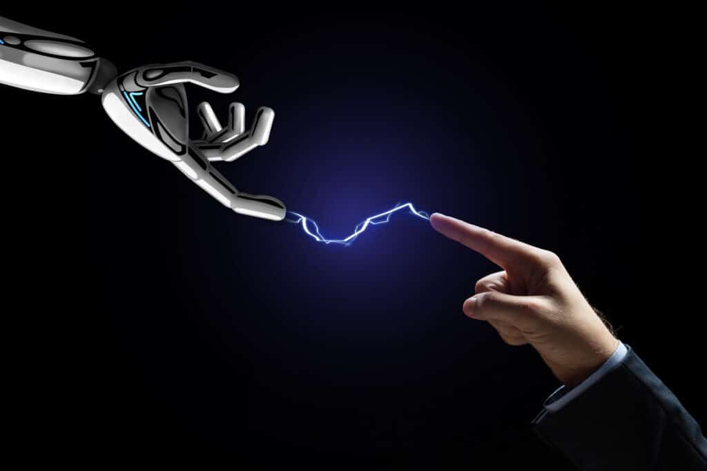 Business, future technology and artificial intelligence concept - robot and human hand connected by lightning over black background