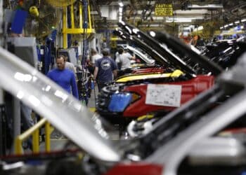 Employees work as Ford Motor Co. Expedition sports utility vehicles (SUV) sit on an assembly line at the Ford Kentucky Truck Plant in Louisville, Kentucky, U.S., on Friday, Oct. 27, 2017. A $900 million company investment upgraded the facility to build the all-new bigger, lighter Expedition and Lincoln Navigator as well as secured 1,000 full-time hourly jobs.