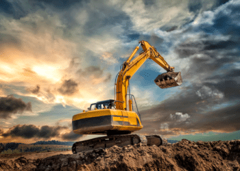 Excavator on a pile of dirt