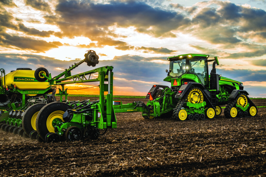 John Deere 8RX Tractor with ExactEmerge Planter While Deere projects financial services growth in 2024