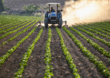 agriculture equipment in use on farm field