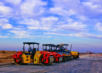red and yellow construction equipment in daytime