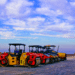 red and yellow construction equipment in daytime