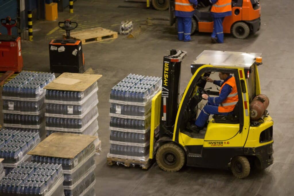 A worker uses a Hyster-Yale Materials Handling Inc. fork-lift truck to move a pallet of beer in the distribution center at the OOO Baltika brewery, operated by Carlsberg A/S, in Saint Petersburg, Russia, on Wednesday, Dec. 17, 2014. Shares in the Danish company, which is the biggest beer maker in Russia, had plunged 15 percent this month through yesterday, giving it a market capitalization of 70 billion kroner ($12 billion).