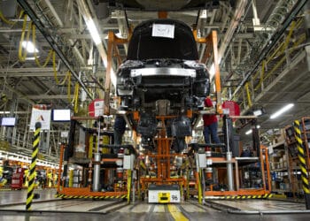Workers assemble the under carriage of vehicles at the Nissan Motor Co. North America manufacturing plant in Canton, Mississippi, U.S., on Thursday, Sept. 8, 2016. The U.S. Census Bureau is scheduled to release durable goods figures on September 28.