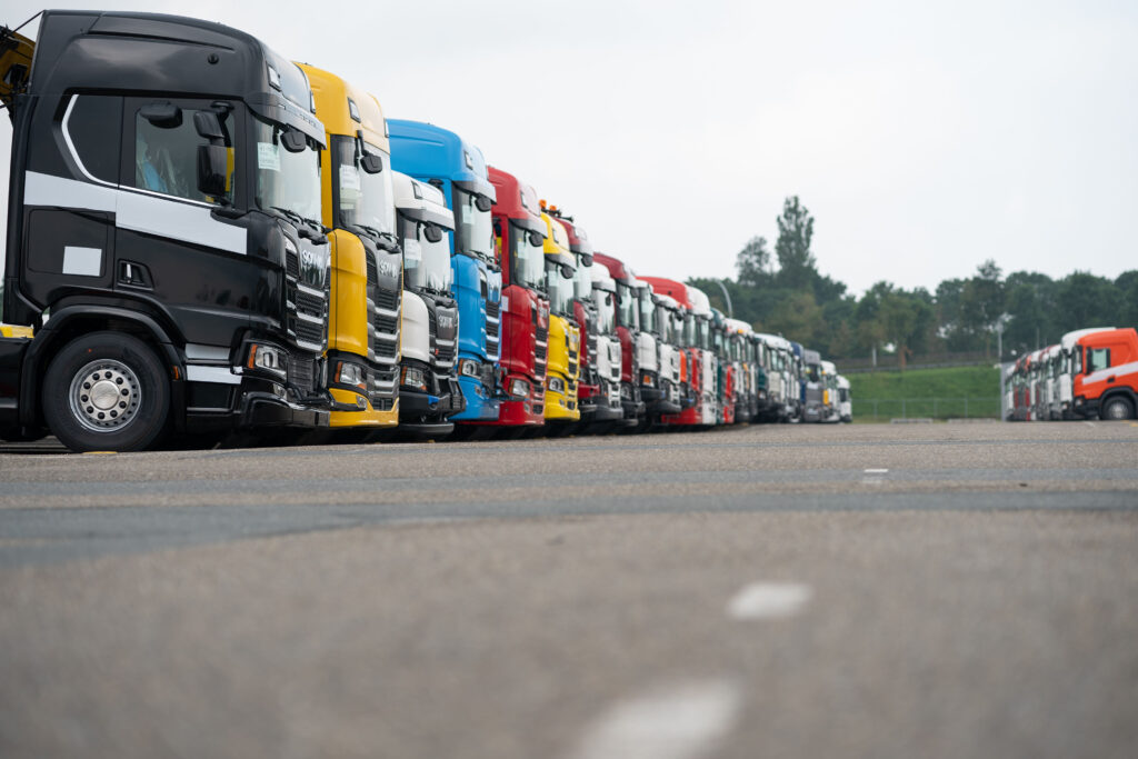 Newly manufactured Scania cargo trucks stand before shipping outside the Scania AB factory in Zwolle, Netherlands, on Thursday, June 20, 2019. Volkswagen AG's initial public offering of its trucks unit, Traton SE, has demand for all of the 50 million shares being offered at the base deal size.