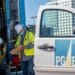 Pacific Gas & Electric Corp. (PG&E) workers wearing protective masks look at clipboard in San Francisco, California, U.S., on Wednesday, Feb. 24, 2021. PG&E Corp. is scheduled to release earnings figures on February 25.
