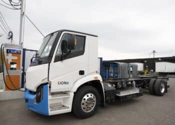 A Lion 6 electric truck charges outside the Lion Electric assembly plant in Saint-Jerome, Quebec, Canada, on Thursday, Oct. 13, 2022. Lion Electric Co. designs, develops, manufactures, and distributes purpose-built all-electric medium and heavy-duty urban vehicles, including seven mid range truck and bus models.