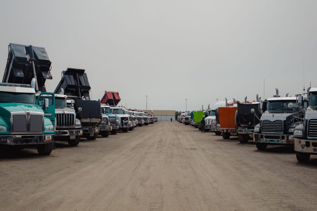Semi-trucks in a lot during a Ritchie Bros heavy equipment auction in Bolton, Ontario, Canada, on Tuesday, May 9, 2023. Ritchie Bros Auctioneers Inc., a Canadian firm that sells heavy equipment at auctions around North America, struck an agreement in November to buy