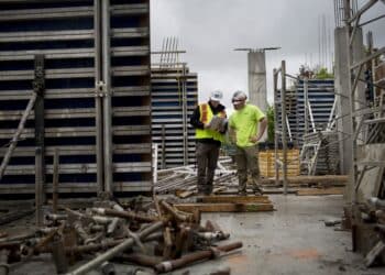 Workers interact at a Tribute Communities Ltd. condominium construction site in Toronto, Ontario, Canada, on Friday, May 26, 2017.
