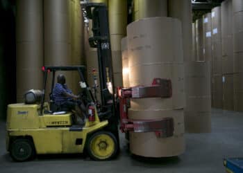 A Hyster Co. truck moves newsprint rolls at the Washington Post newspaper production facility in Springfield, Virginia, U.S., on Friday, July 12, 2013. The Washington Post began publishing on Thursday, Dec. 6, 1877, and had a circulation of 10,000. The newspaper contained four pages and cost three cents a copy.