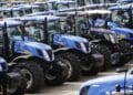 Newly manufactured New Holland T6 and T7 tractors stand parked in a yard ahead of shipping at CNH Industrial NV's assembly plant in Basildon, U.K., on Wednesday, July 2, 2014. CNH Industrial plans to more than double profit by 2018 as the maker of Iveco trucks and New Holland tractors sets its sights on expansion in Asia.