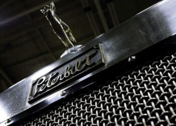 The Peterbilt Motors Co. logo is displayed on the grill of a truck at the 16th annual Great American Trucking Show in Dallas, Texas, U.S., on Friday, Aug. 22, 2014. U.S. freight shipments by truck rose 1.3 percent in July from the previous month, according to the American Trucking Association.