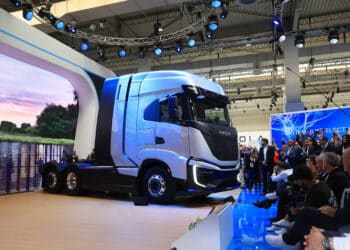 Visitors watch the unveiling of a Nikola Corp. Tre FCEV truck at the IAA Transportation show in Hanover, Germany, on Monday, Sept. 19, 2022. Global leaders Daimler Truck Holding AG and Volvo AB are joining dozens of commercial-vehicle makers in Germany this week to showcase their latest electric semis, with more zero-emissions vehicles debuting at the IAA Transportation show than ever before.