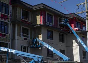 A residential building under construction in Vancouver, British Columbia, Canada, on Friday, April 19, 2024. Homebuilders in the province of British Columbia are constantly against the clock: it has a law that gives them just 12 months to market their projects, collect enough deposits and secure the financing to build.