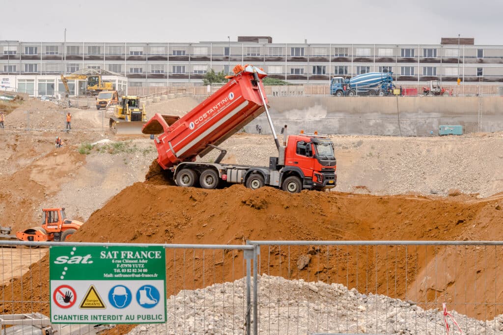A hydraulic truck dumps earth on the construction site of the European Union (EU) Court of Justice extension project in the Plateau de Kirchberg district of Luxembourg, on Monday, July 15, 2019. Brexit has made Luxembourg a favorite EU hub for insurers, funds and asset managers to relocate to from the U.K. Moves include those by insurance giant American International Group Inc., private-equity firm Blackstone, RSA Insurance Group Plc, U.S. insurer FM Global, Lloyd's of London insurer Hiscox Plc and asset manager M&G Investments.