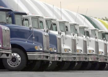 Used International trucks manufactured by Navistar International sit on the lot of the company's used truck facility in Melrose Park, Illinois Wednesday, Aug. 15, 2001. The fourth-largest truckmaker reported fiscal third-quarter earnings fell 98 percent as a glut of used trucks and the effects of the slowing U.S. economy reduced demand. The Melrose Park lot, one of 15 company owned lots, has nearly 300 trucks in inventory.