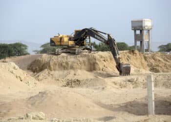 A Volvo Inc. excavator operates at a road construction site in Gwadar, Balochistan, Pakistan, on Tuesday, July 4, 2018. What used to be a small fishing town on the southwestern corner of Pakistan is giving way for construction of roads and buildings to house banks, insurance and clearing agents. China Overseas Port Holdings, Gwadar Ports operator, has separately spent $250 million to add five new cranes, construct a building in less than six months by importing ready made parts and create space for a free zone.