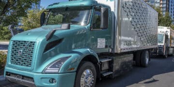 A Volvo Trucks VNR electric class 8 tractor during an electric vehicle showcase and display outside the Department of Transportation headquarters in Washington, D.C., U.S., on Wednesday, Oct. 20, 2021. The congressional bipartisan infrastructure deal includes a $7.5 billion investment in electric vehicle charging and more than $10 billion for zero and low-emission buses as part of the White House administration's effort to transition to clean energy.