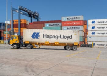 A semi-truck hauls a container at the Sociedad Portuaria Regional de Cartagena (SPRC) terminal at the Port of Cartagena in Cartagena, Colombia, on Thursday, Dec. 9, 2021. Colombia's exports rose to $3.795b in October from $3.573b in September.