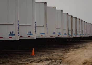 Trailers in a lot during a Ritchie Bros heavy equipment auction in Bolton, Ontario, Canada, on Tuesday, May 9, 2023. Ritchie Bros Auctioneers Inc., a Canadian firm that sells heavy equipment at auctions around North America, struck an agreement in November to buy IAA, which sells damaged and written-off vehicles.