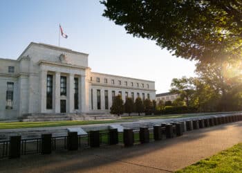 Fed cuts rates by half point In decisive bid to defend economy