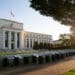 Fed cuts rates by half point In decisive bid to defend economy