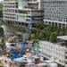 A construction site in front of commercial buildings in Tokyo, Japan, on Wednesday, Sept. 18, 2024. Traders betting on further recovery in Japanese equities are looking to any steer from the Bank of Japan that may cap the yens gains and support exporters.