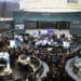 Attendees and traders fill the trading floor as Volkwagen AG's Traton SE truck unit makes its initial public offering (IPO) at the Frankfurt Stock Exchange, operated by Deutsche Boerse AG, in Frankfurt, Germany, on Friday, June 28, 2019. Volkswagen raised 1.55 billion euros ($1.8 billion) selling a stake in its trucks business, but only after pricing the offer at the low end of a target range to attract investors to one of Europes biggest initial public offerings this year.