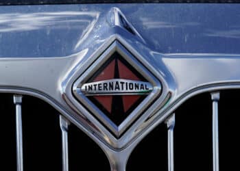 An International Trucks logo on the grille of a semi truck at Hight Logistics in Long Beach, California, US, on Monday, Dec. 5, 2022. Forum Mobility replaces diesel drayage freight trucks, a major source of toxic emissions, with electric models for a monthly fee.