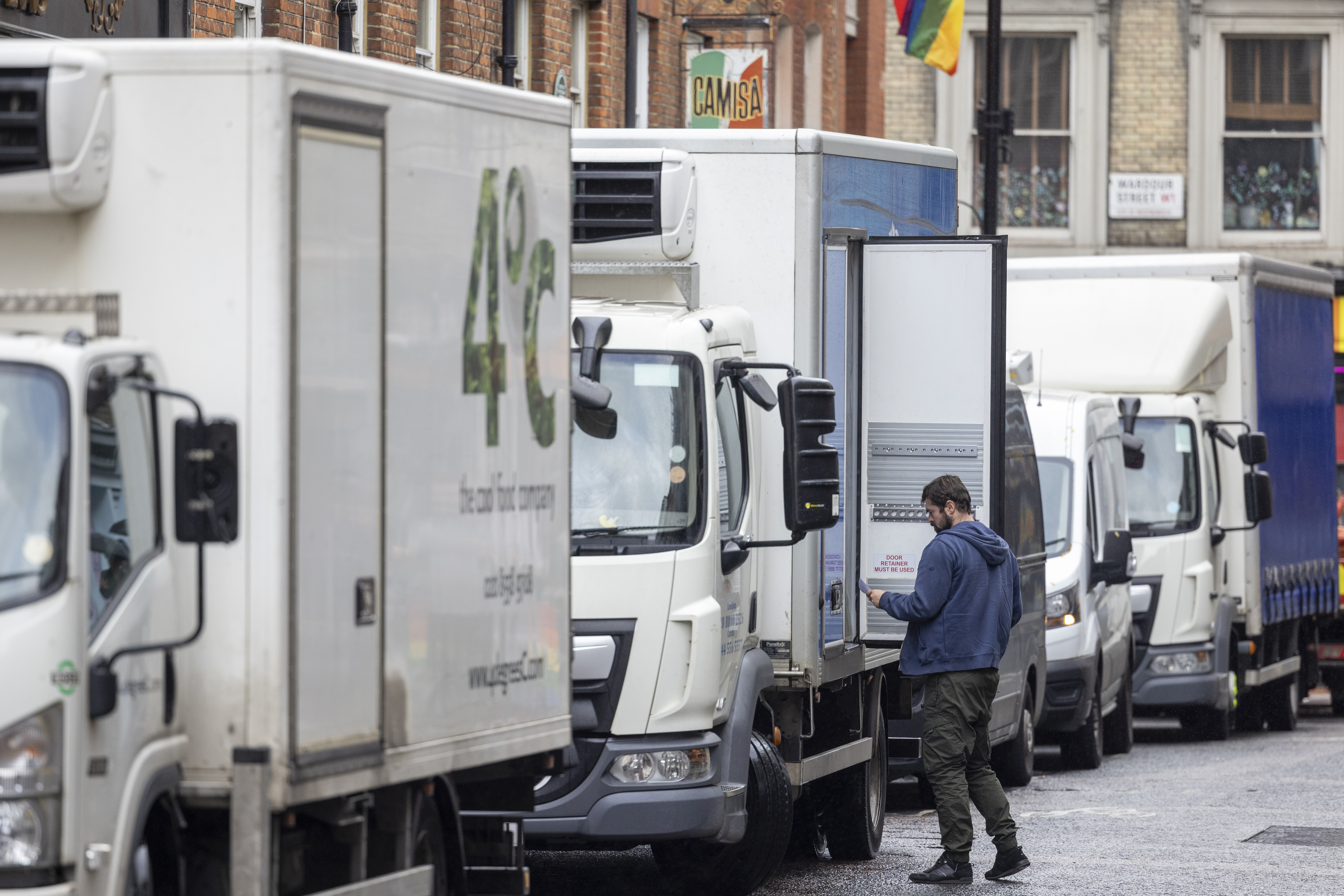 A lorry driver unloads a delivery from a truck in central London, UK, on Monday, Sept. 23, 2024. The UK flash composite PMI survey for September adds to evidence that Britains activity is cooling after a speedy recovery in the first half of the year, according to Bloomberg Intelligence.