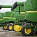 Deere & Co. John Deere combine harvesters sit on display during the Farm Progress Show in Boone, Iowa, U.S., on Tuesday, Aug. 28, 2018. The show, sponsored by Farm Progress Co. and owned by Penton Media, is billed as the largest outdoor farm show in the U.S.