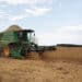 A farmer operates a Deere & Co. combine to harvest soybeans in Ita, Sao Paulo state, Brazil, on Wednesday, Feb. 24, 2021. The impact of Brazils late soybean harvest has hit the roads of the nations northern export route, ensnaring truckers in long lines and threatening further delays of shipments to China.