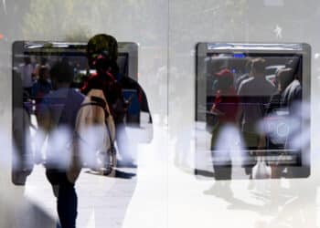 A customer uses an ATM in New York.