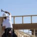 A contractor hammers the frame of a home under construction at the D.R. Horton Express Homes Magma Ranch housing development in Florence, Arizona, U.S., on Thursday, Nov. 16, 2017. The U.S. Census Bureau release housing starts figures on November 17.