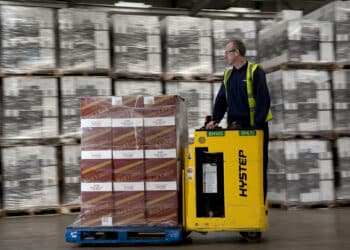 An employee uses a Hyster pallet truck to move a crate of packaged boxes of Johnnie Walker Red Label blended scotch whisky through the warehouse at Diageo Plc's bottling plant in Leven, Scotland, on Wednesday, June 19, 2013. Diageo Chief Executive Officer Paul Walsh will step down in July, almost 13 years shaping the company into the world's largest distiller and hand over the reins to his chief operating officer Ivan Menezes.