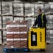An employee uses a Hyster pallet truck to move a crate of packaged boxes of Johnnie Walker Red Label blended scotch whisky through the warehouse at Diageo Plc's bottling plant in Leven, Scotland, on Wednesday, June 19, 2013. Diageo Chief Executive Officer Paul Walsh will step down in July, almost 13 years shaping the company into the world's largest distiller and hand over the reins to his chief operating officer Ivan Menezes.