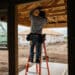 A worker installs electrical wiring in a home that is under construction in Kyle, Texas, US, on Monday, March 18, 2024. The US Census Bureau is scheduled to release housing starts figures on March 19.