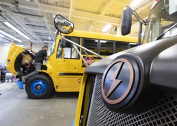A badge on a Lion C electric school bus at the Lion Electric assembly plant in Saint-Jerome, Quebec, Canada, on Thursday, Oct. 13, 2022. Lion Electric Co. designs, develops, manufactures, and distributes purpose-built all-electric medium and heavy-duty urban vehicles, including seven mid range truck and bus models.