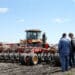 An AGCO Corp. Challenger tractor pulls a Bourgault Tillage Tools Ltd. air seeder while planting canola seeds on a farm near St. Francois Xavier, Manitoba, Canada on Thursday, May 9, 2019. Prime Minister Justin Trudeau's government is expanding a loan program for farmers and launching a trade mission to Japan and South Korea as Canadian canola exports get caught up in a diplomatic feud with China.