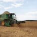 A farmer operates a Deere & Co. combine to harvest soybeans in Ita, Sao Paulo state, Brazil, on Wednesday, Feb. 24, 2021. The impact of Brazils late soybean harvest has hit the roads of the nations northern export route, ensnaring truckers in long lines and threatening further delays ofshipmentsto China.