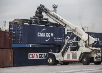 A Terex Corp. reach stacker transports a CMA CGM SA shipping container in the Med Europe Terminal at the Port of Marseille, France, on Friday, Dec. 18, 2015. Marseilles-based CMA CGM currently has 8.8 percent of the global shipping market.